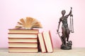 Law concept - Open law book scales, Themis statue on table in a courtroom or law enforcement office Royalty Free Stock Photo