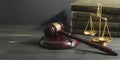 Law concept - Open law book with a wooden judges gavel on table in a courtroom or law enforcement office isolated on Royalty Free Stock Photo