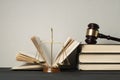 Law concept. Wooden judge gavel,scales of justice and books on table in a courtroom or enforcement office. Royalty Free Stock Photo