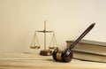 Law concept. Wooden judge gavel,scales of justice and books on table in a courtroom or enforcement office. Royalty Free Stock Photo