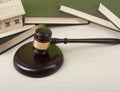 Law concept - wooden judge gavel on table in a courtroom or enforcement office