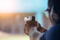 Law enforcement aim pistol by two hand in academy shooting range