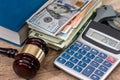 Law gavel with Dollars in book and handcuffs Royalty Free Stock Photo