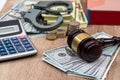 Law gavel with handcuffs, dollars and books Royalty Free Stock Photo