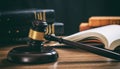 Judge gavel on a wooden desk, law books background Royalty Free Stock Photo