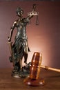 Law and justice stuff on wooden table, dark background Royalty Free Stock Photo