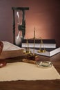 Law and justice stuff on wooden table, dark background Royalty Free Stock Photo