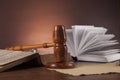 Law and justice stuff on wooden table, dark background Royalty Free Stock Photo