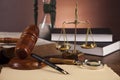 Law and justice stuff on wooden table, dark background Royalty Free Stock Photo