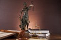 Law and justice stuff on wooden table, dark background Royalty Free Stock Photo