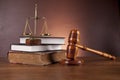 Law and justice stuff on wooden table, dark background Royalty Free Stock Photo