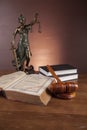 Law and justice stuff on wooden table, dark background Royalty Free Stock Photo