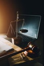 law legal technology concept. judge gavel on computer with scales of justice on desk of lawyer Royalty Free Stock Photo