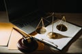 law legal technology concept. judge gavel on computer with scales of justice on desk of lawyer Royalty Free Stock Photo