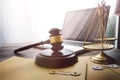 law legal technology concept. judge gavel on computer with scales of justice on desk of lawyer Royalty Free Stock Photo