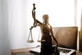 law legal technology concept. judge gavel on computer with scales of justice on desk of lawyer Royalty Free Stock Photo