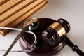 Law mallet or Judge gavel and medical stethoscope