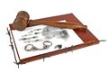 Law and Order. Wooden gavel with book, handprint, handcuffs and barbed wire on white background