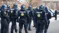 Law, security and back of police in city during a protest or march for protection and public service. Safety, violence Royalty Free Stock Photo