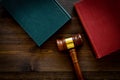 Law student concept. Judge gavel and vintage books on dark wooden background top view copy space Royalty Free Stock Photo