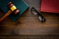 Law student concept. Judge gavel and vintage books on dark wooden background top view copy space Royalty Free Stock Photo