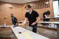 Law students clean desk in hybrid classroom