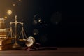 Law symbols on a wooden table, including a gavel, scales of justice, and books, with a warm, boken lights Royalty Free Stock Photo