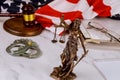 Law United States of America, statue of Lady Justice with file justice documents folder United States of America Flag Royalty Free Stock Photo