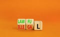 Lawful or illegal symbol. Concept word Lawful or Illegal on wooden cubes. Beautiful orange table orange background. Business