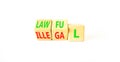 Lawful or illegal symbol. Concept word Lawful or Illegal on wooden cubes. Beautiful white table white background. Business lawful