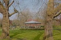 Lawn with bare oak trees and pavilon in Stephen`s Green park, Dublin