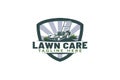 lawn care logo with a combination of grassland, lawn mower, and shield Royalty Free Stock Photo