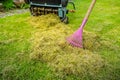 Lawn care - verticut, thatch the grass, aerating and scarifying the lawn in the garden Royalty Free Stock Photo