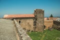 Lawn on castle central courtyard among stone walls and tower Royalty Free Stock Photo