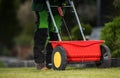 Lawn Grass Fertilizing Using Manual Push Spreader Royalty Free Stock Photo