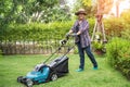 Lawn mover machine cut green grass, Hobby planting home garden Royalty Free Stock Photo