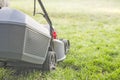 Lawn mower cutting grass. Gardening concept background. Close up of lawn mowers Royalty Free Stock Photo