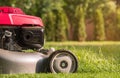 Lawn mower cutting grass Royalty Free Stock Photo