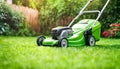 Lawn mower cutting green grass in backyard, mowing Royalty Free Stock Photo