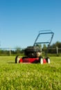 Lawn mower on grass Royalty Free Stock Photo