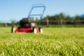 Lawn mower on grass Royalty Free Stock Photo