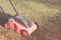 Lawn mower on the grass/lawn mower on the grass. Selective focus. Toned Royalty Free Stock Photo