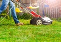 Lawn mower man using walk behind lawnmower Royalty Free Stock Photo