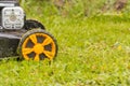 Lawn mower. Mow the lawn with a lawn mower. Royalty Free Stock Photo