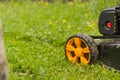 Lawn mower. Mow the lawn with a lawn mower. Royalty Free Stock Photo