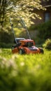 Lawn mower sits in grass on sunny day Royalty Free Stock Photo