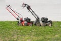 Lawn mowers on green grass, time to cut high grass Royalty Free Stock Photo