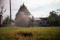 Lawn sprinkler spaying water over green grass. Irrigation system Royalty Free Stock Photo