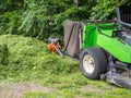 Lawn tractor at mowing in the park Royalty Free Stock Photo