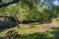 Lawn with wooden picnic tables next to the river beach of PoÃ§o de Corga, Castanheira de PÃªra PORTUGAL Royalty Free Stock Photo